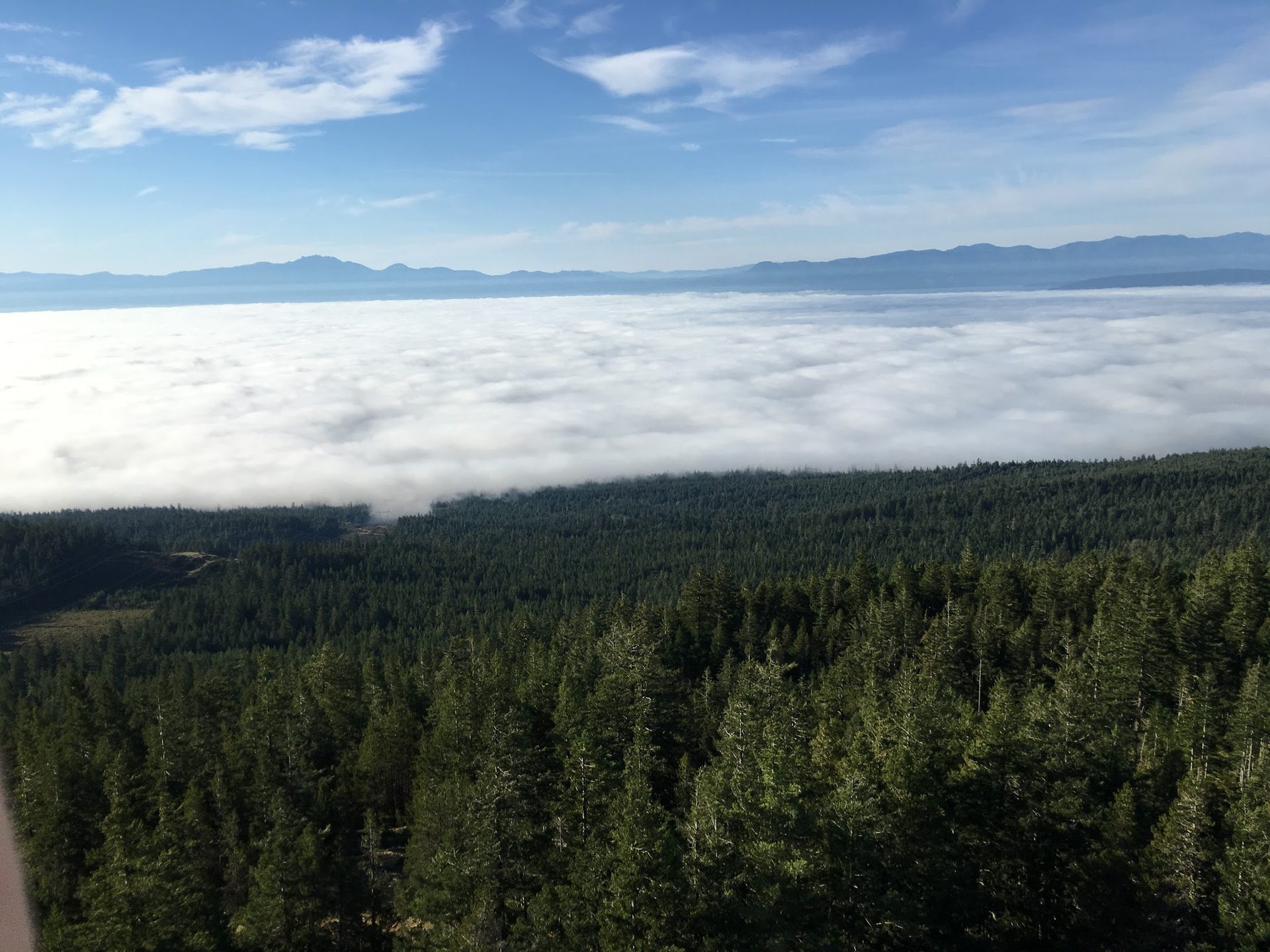 View above the clouds from a mountaintop communications tower site